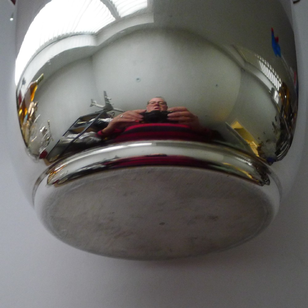 A polished silver-plated French champagne bucket with twin side handles and a detailed reeded rim. View VII