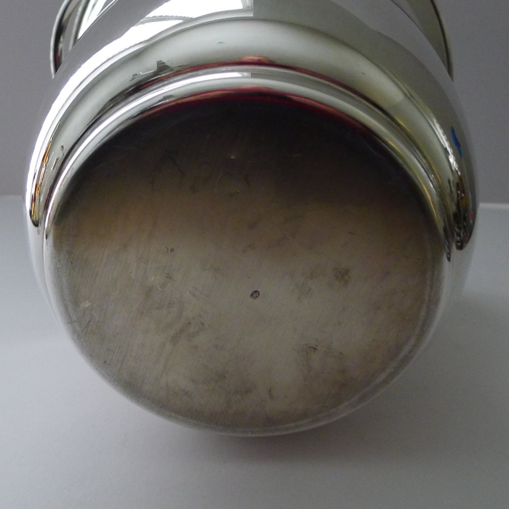A polished silver-plated French champagne bucket with twin side handles and a detailed reeded rim. View VIII
