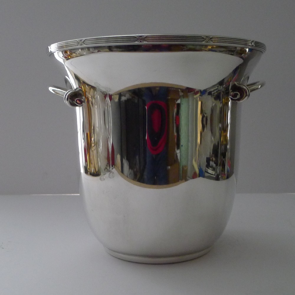 A polished silver-plated French champagne bucket with twin side handles and a detailed reeded rim. View XIV