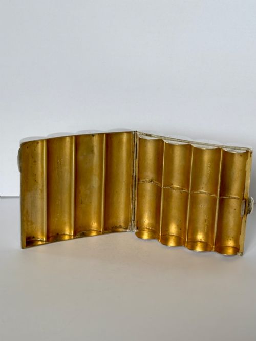 fig 1. A four-tube sterling silver tobacco cartridge case with a hinged cover and smooth polished finish.