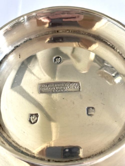 fig 4. Late Victorian Scottish silver quaich featuring cast stag head handles and an engraved military presentation inscription on a circular pedestal base.