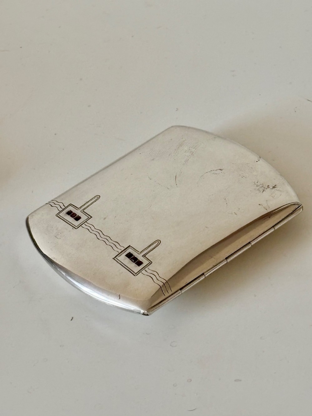 An Art Deco German 800 Silver synthetic ruby cigarette case c1925