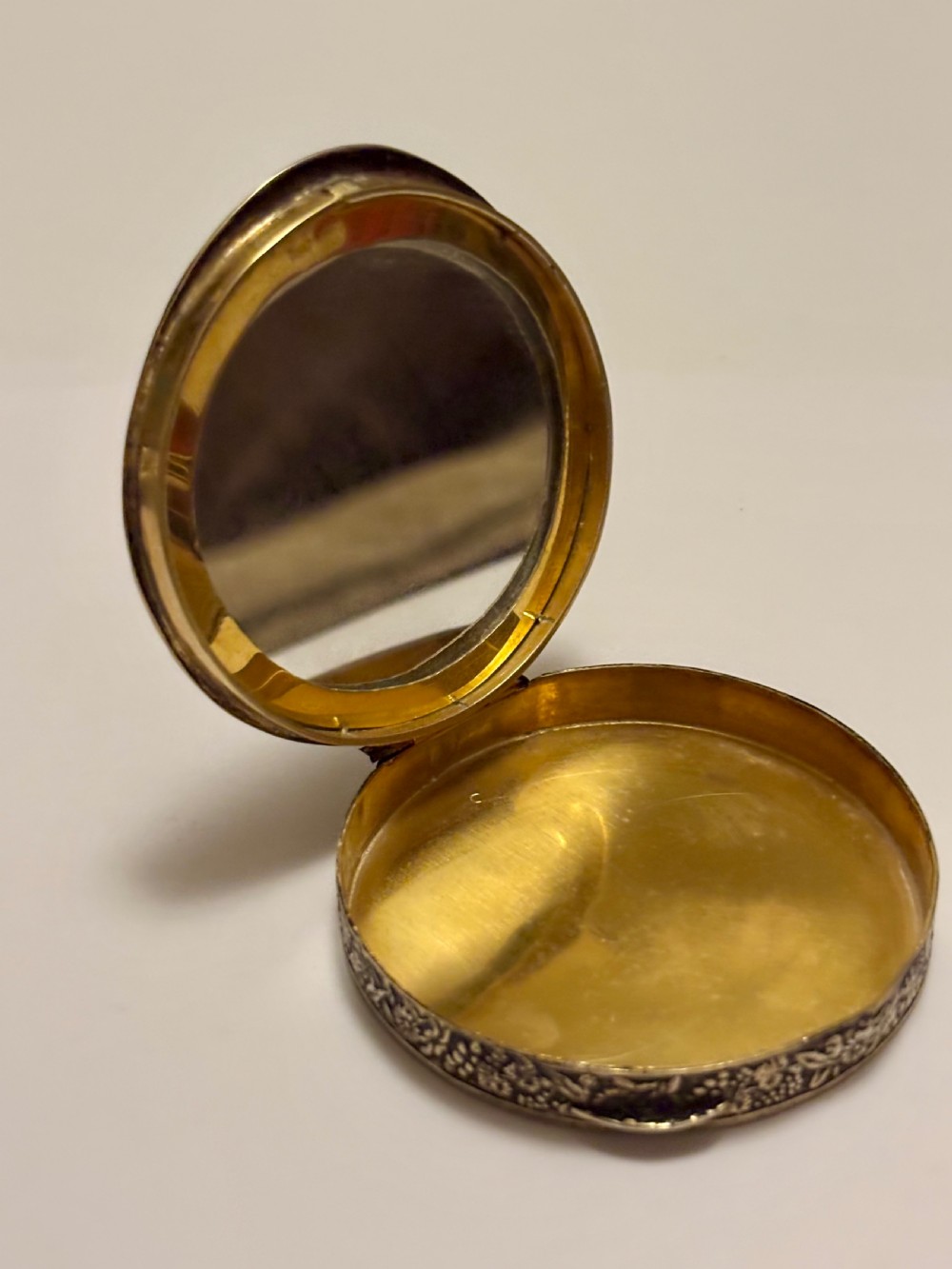 A circular vintage Italian 800 silver powder compact featuring a hand-painted enamel scene of harvest workers framed by a cobalt blue enamel border. View X