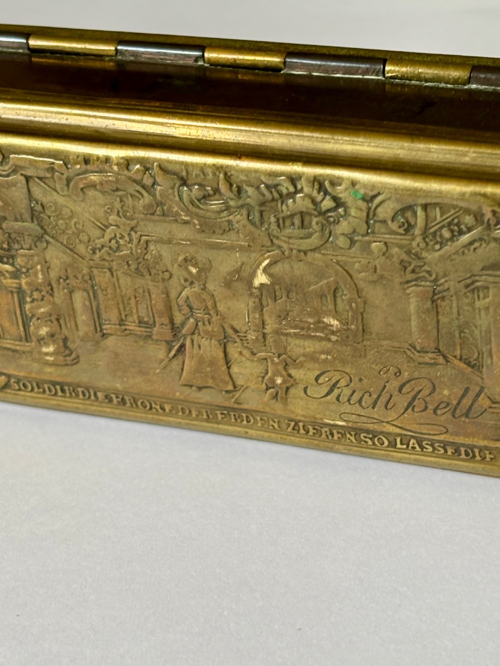 An oblong 18th-century brass and copper tobacco box featuring relief engravings of military battle scenes and portrait medallions on its lid. View XIII
