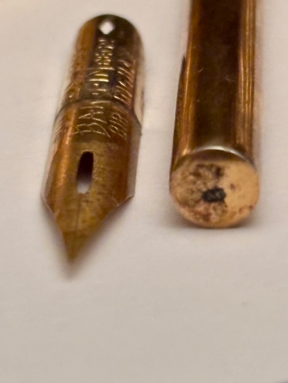 An open fitted presentation box containing two silver gilt candlesticks, a central inkwell, and a dip pen. View XIII