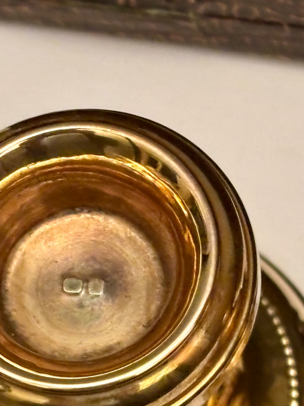 An open fitted presentation box containing two silver gilt candlesticks, a central inkwell, and a dip pen. View XV
