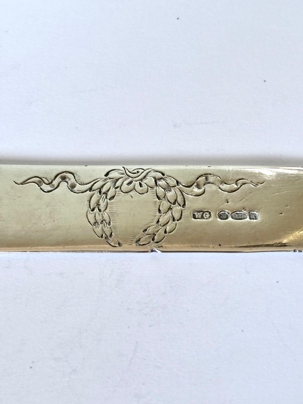 An Edwardian sterling silver letter opener featuring a cast figure of Napoleon on the handle and an engraved laurel wreath on the blade. View III