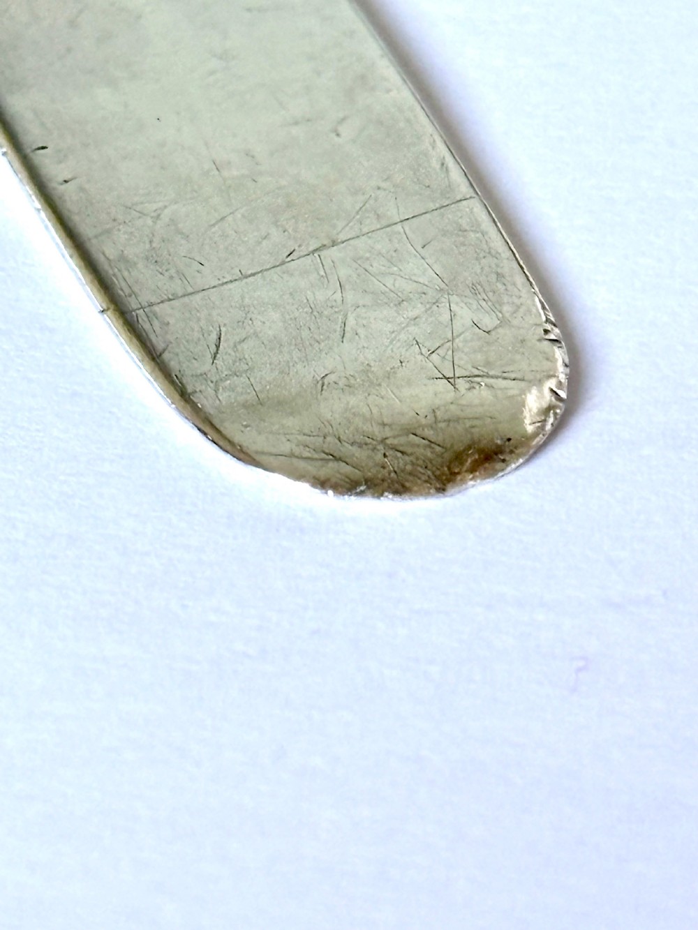 An Edwardian sterling silver letter opener featuring a cast figure of Napoleon on the handle and an engraved laurel wreath on the blade. View VIII