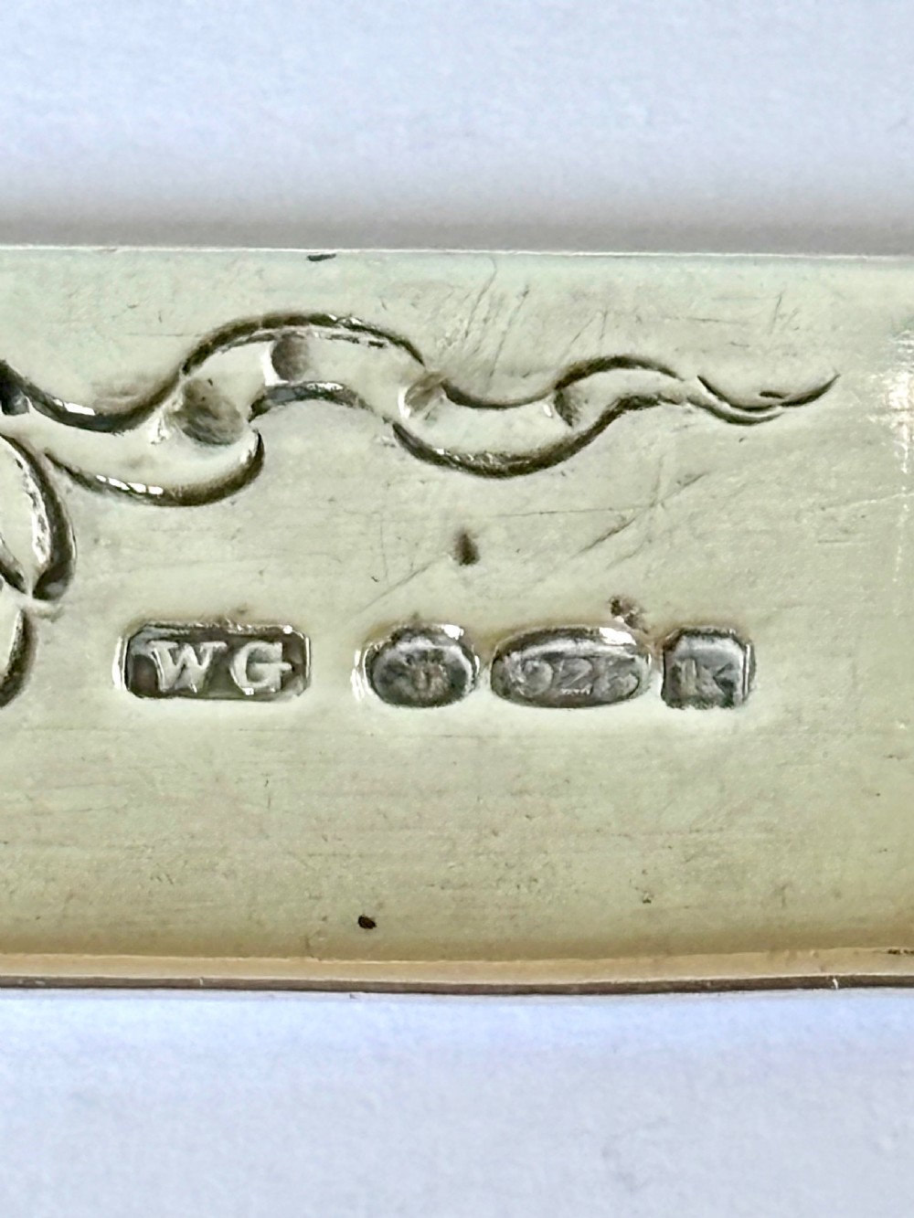 An Edwardian sterling silver letter opener featuring a cast figure of Napoleon on the handle and an engraved laurel wreath on the blade. View IX
