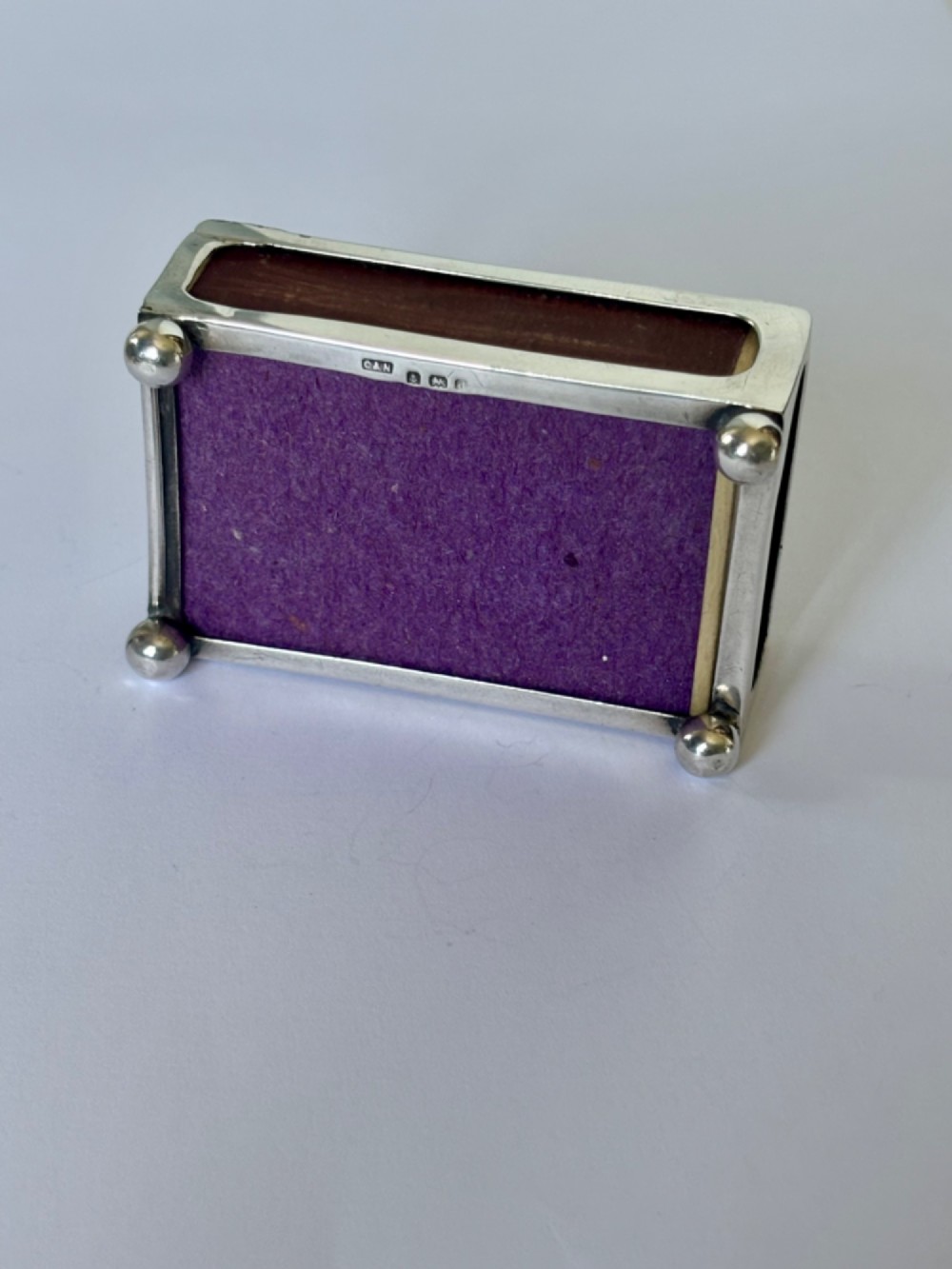 A rectangular silver matchbox cover featuring an embossed relief depicting Windsor Castle surrounded by scrollwork borders. View VIII