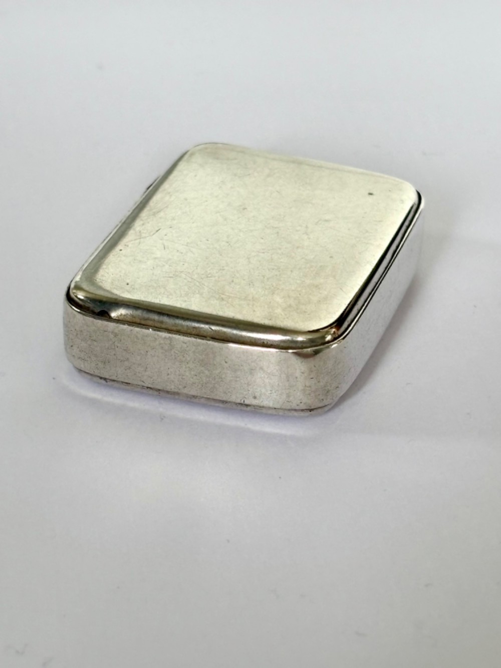 A small rectangular Victorian sterling silver vesta case with rounded corners and reeded sides. View II