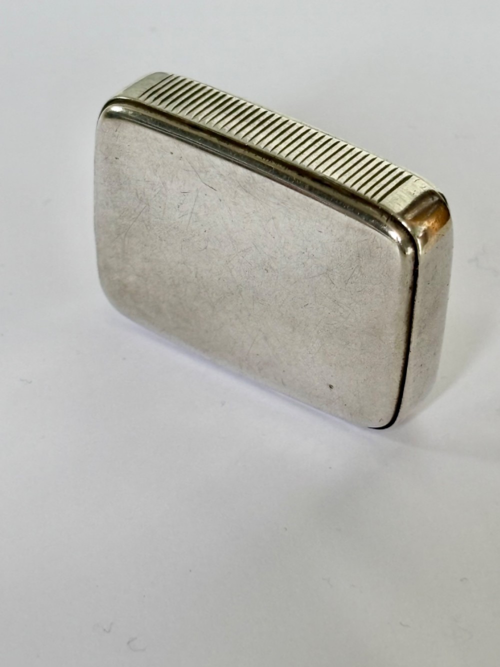 A small rectangular Victorian sterling silver vesta case with rounded corners and reeded sides. View IV