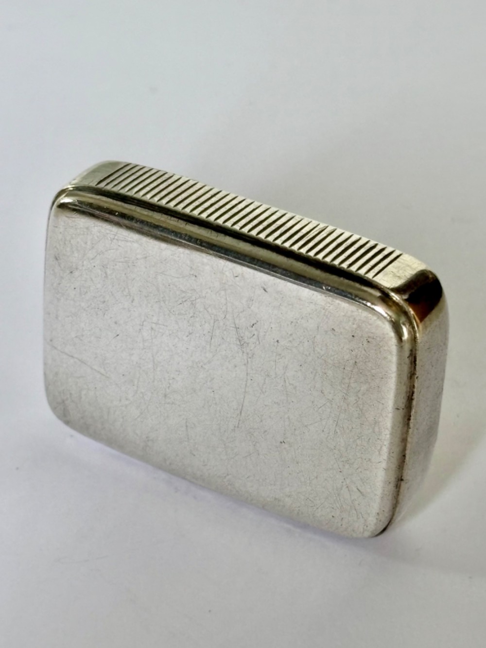 A small rectangular Victorian sterling silver vesta case with rounded corners and reeded sides. View V