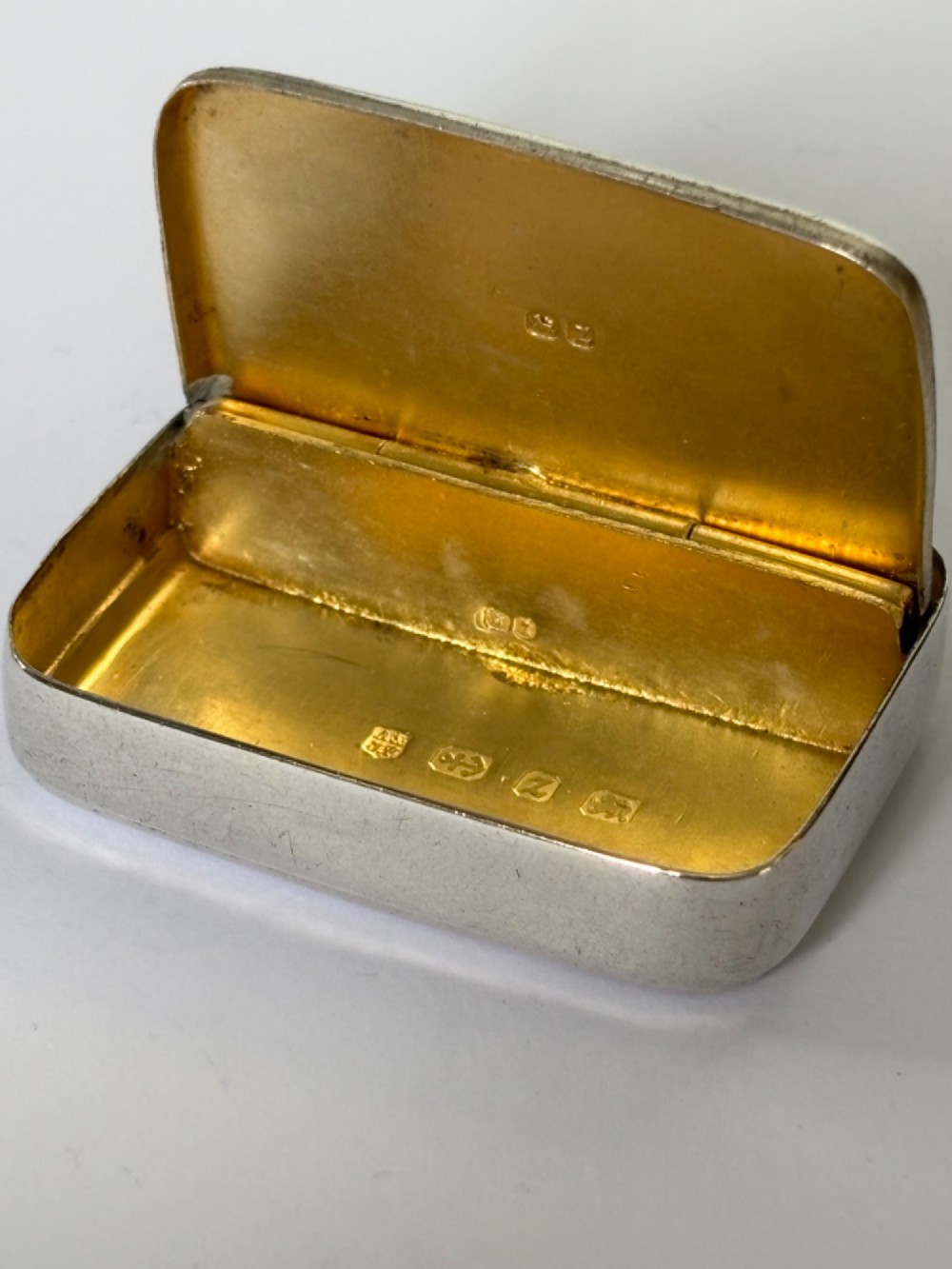 A small rectangular Victorian sterling silver vesta case with rounded corners and reeded sides. View VI