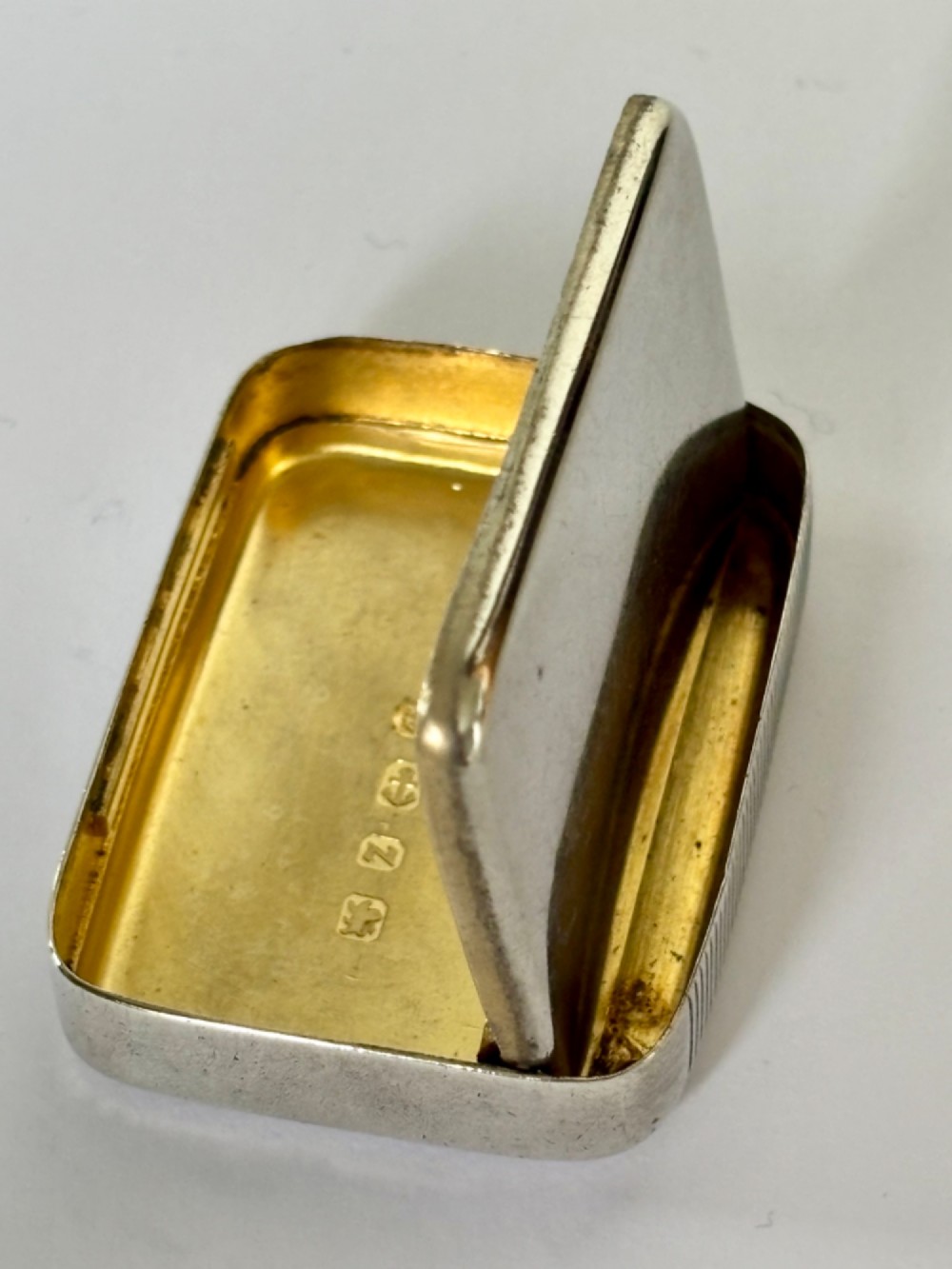 A small rectangular Victorian sterling silver vesta case with rounded corners and reeded sides. View IX