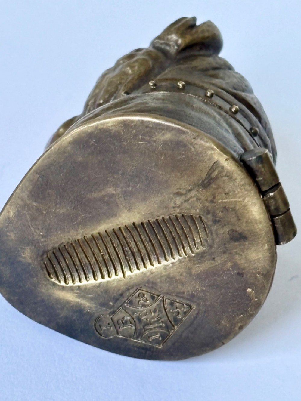 A cast brass table-top vesta case sculpted in the form of a bulldog head featuring inset yellow glass eyes and a studded collar. View IX