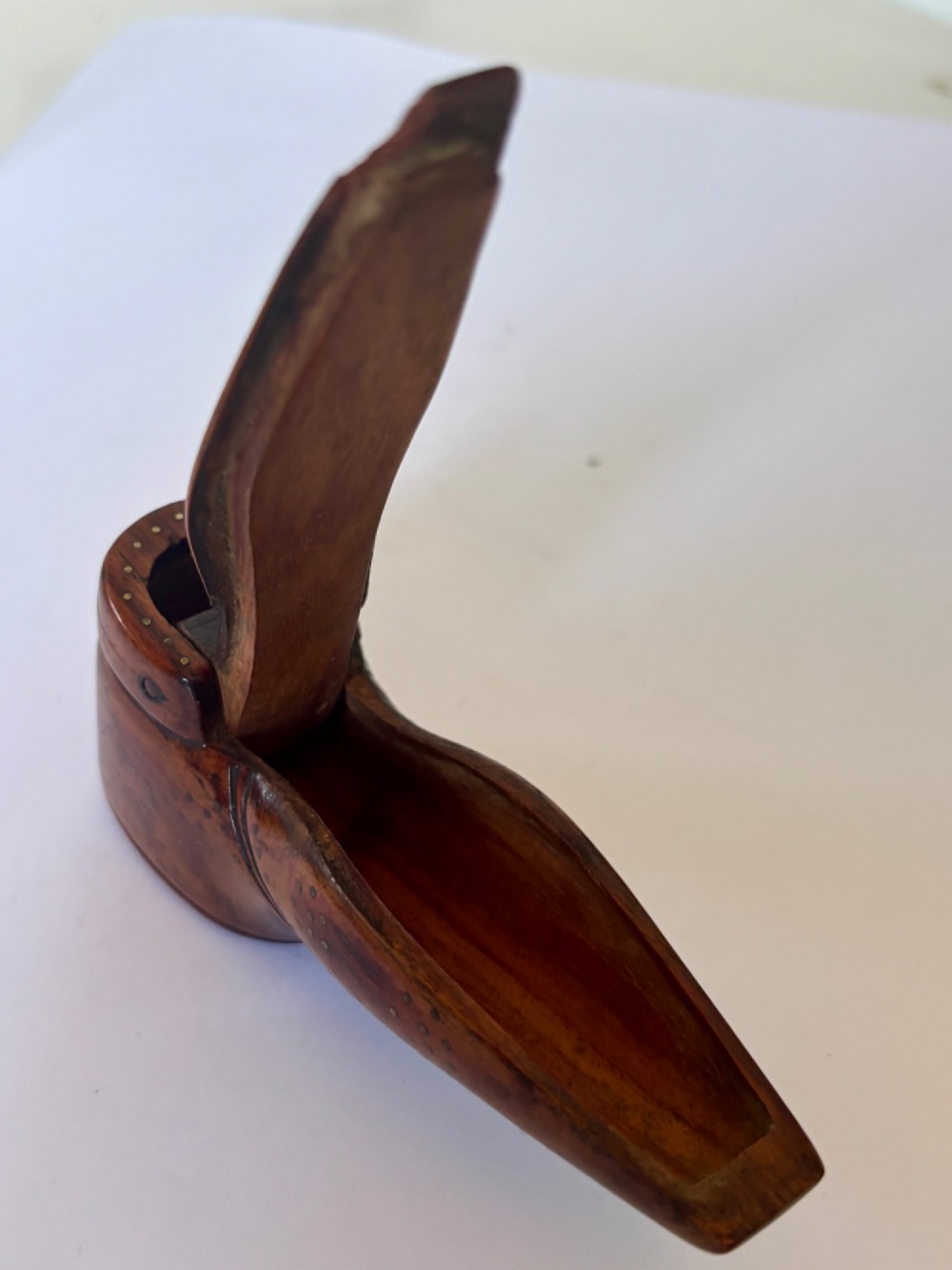 A 19th-century carved wooden shoe-form snuff box featuring brass pique pinwork and a geometric parquetry inlaid lid. View XIII