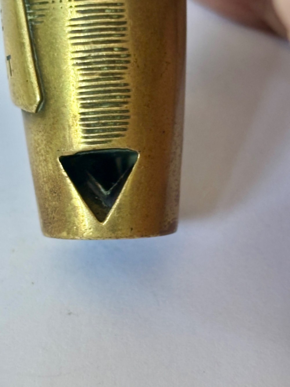 A nineteenth-century brass novelty vesta case and cigar cutter shaped like a champagne bottle with stamped Veuve Clicquot lettering. View III