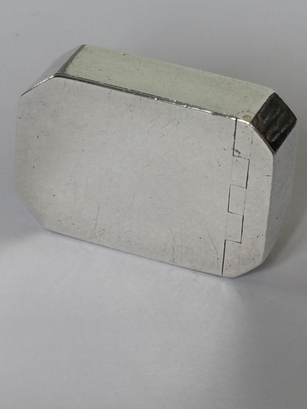 An 18th-century Georgian sterling silver pocket snuff box featuring canted corners and a flush integrated hinge. View IV