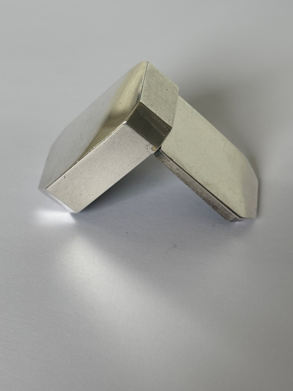 An 18th-century Georgian sterling silver pocket snuff box featuring canted corners and a flush integrated hinge. View IX