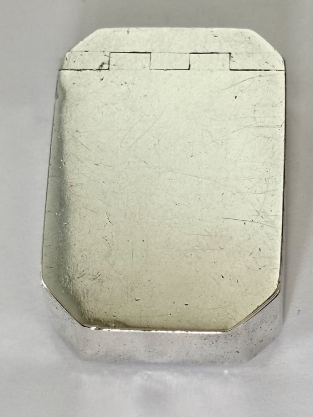 An 18th-century Georgian sterling silver pocket snuff box featuring canted corners and a flush integrated hinge. View XI