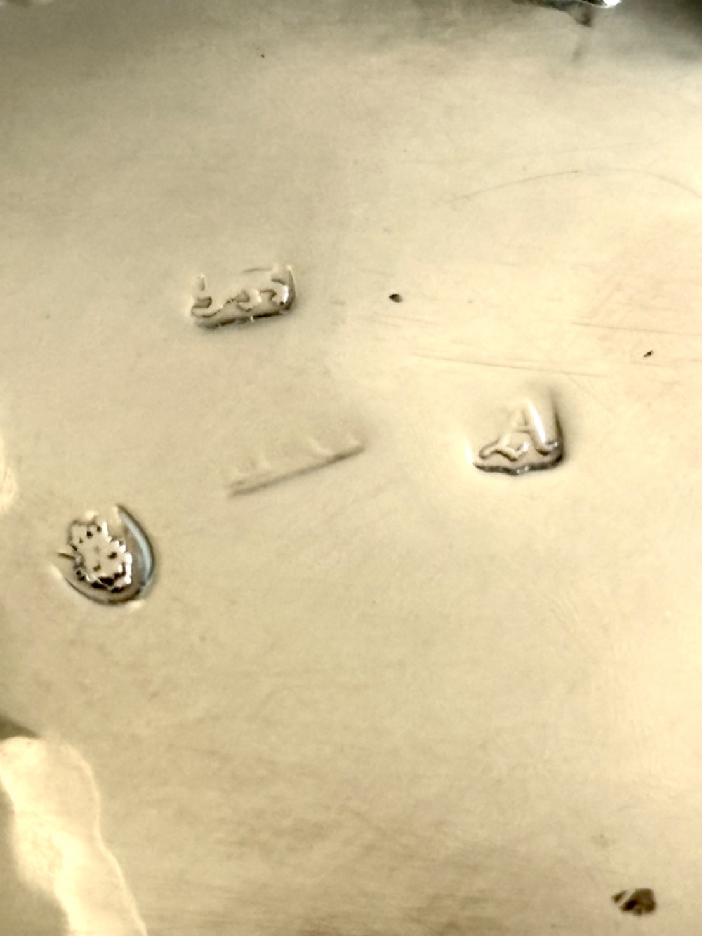 A pair of round 18th-century sterling silver open salt cellars with cobalt blue glass liners, raised on three hoof feet. View XIII