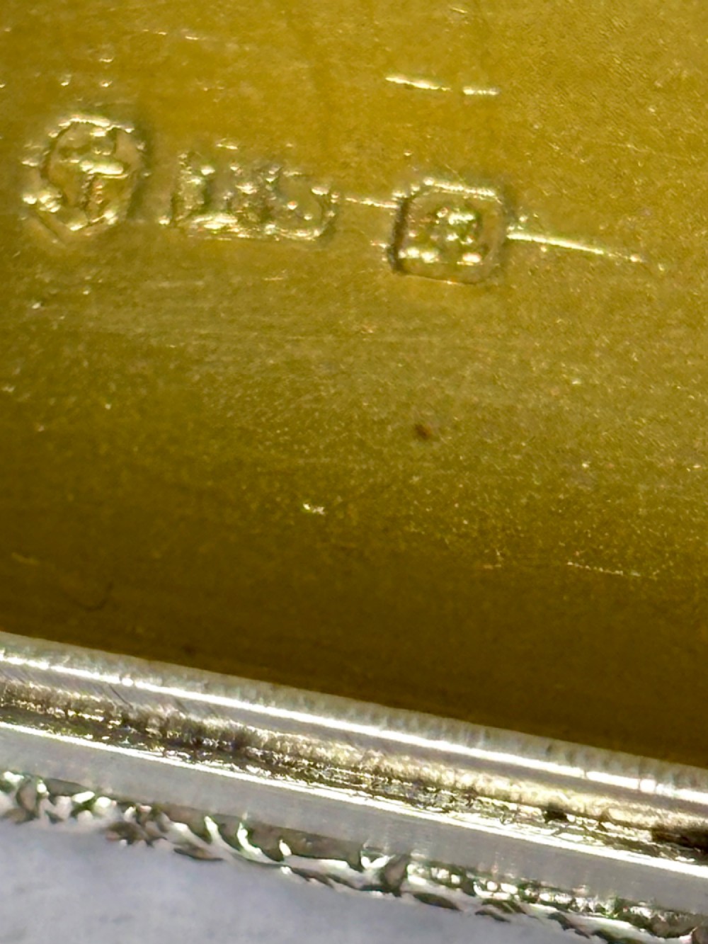 An open rectangular William IV silver gilt snuff box featuring reeded side panels, chased borders, and clear silver hallmarks inside the gilded lid. View IV