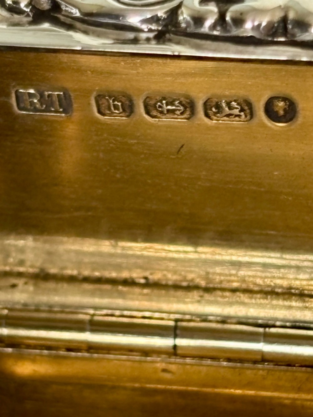 A Victorian silver gilt rectangular snuff box featuring engine-turned reeded decoration and a central rectangular cartouche on the lid. View II