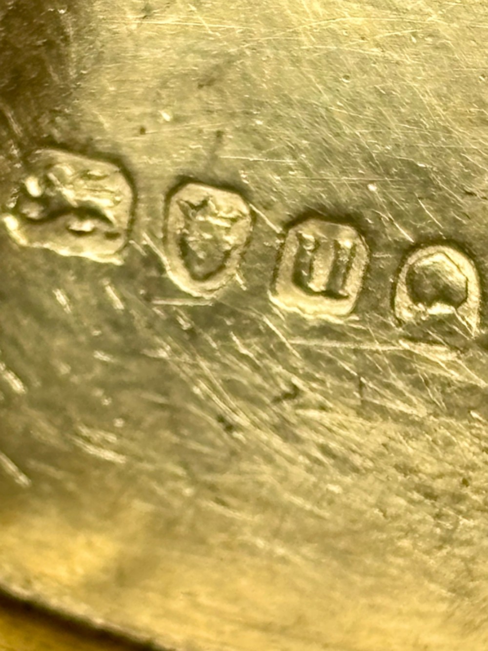 An elongated Georgian sterling silver snuff box with rounded ends, engraved on the lid with the Isle of Man triskelion crest. View IX