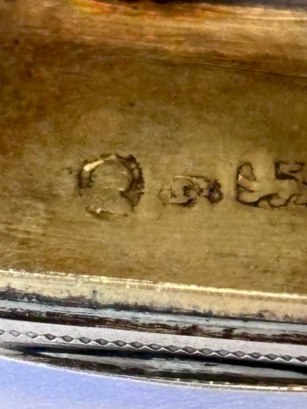 A small rectangular Georgian silver vinaigrette box with hand-engraved wrigglework patterns and a plain central oval cartouche. View X