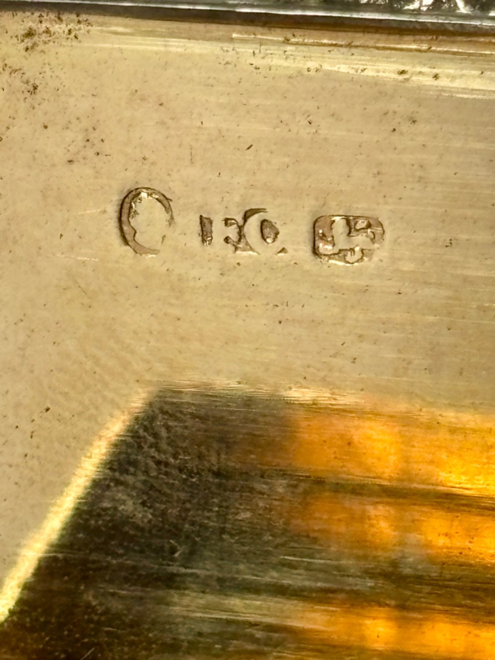 A rectangular Georgian sterling silver snuff box displaying geometric engine-turned patterns, a blank central cartouche, and reeded side edges. View VII