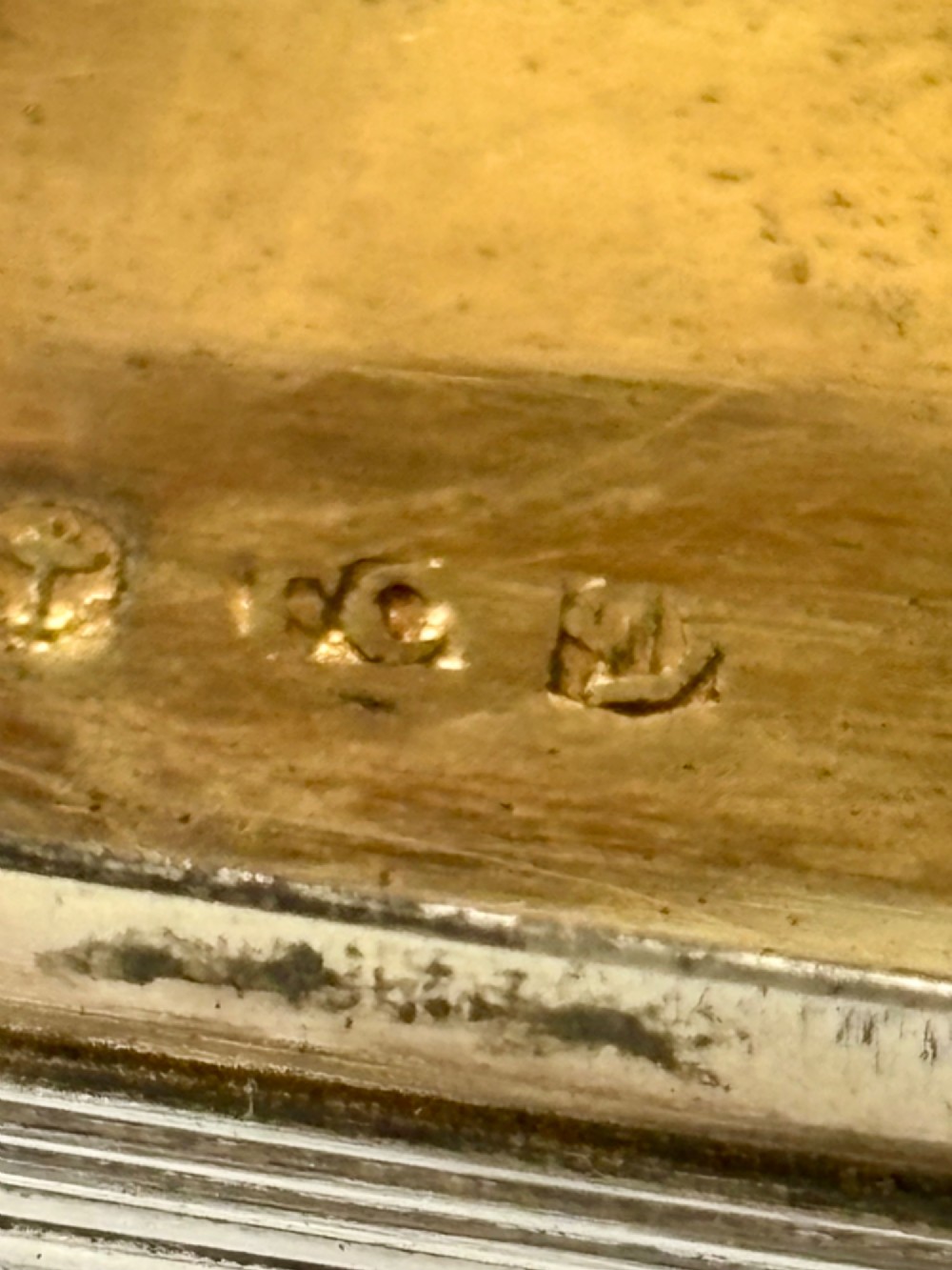 A rectangular Georgian sterling silver snuff box displaying geometric engine-turned patterns, a blank central cartouche, and reeded side edges. View IX