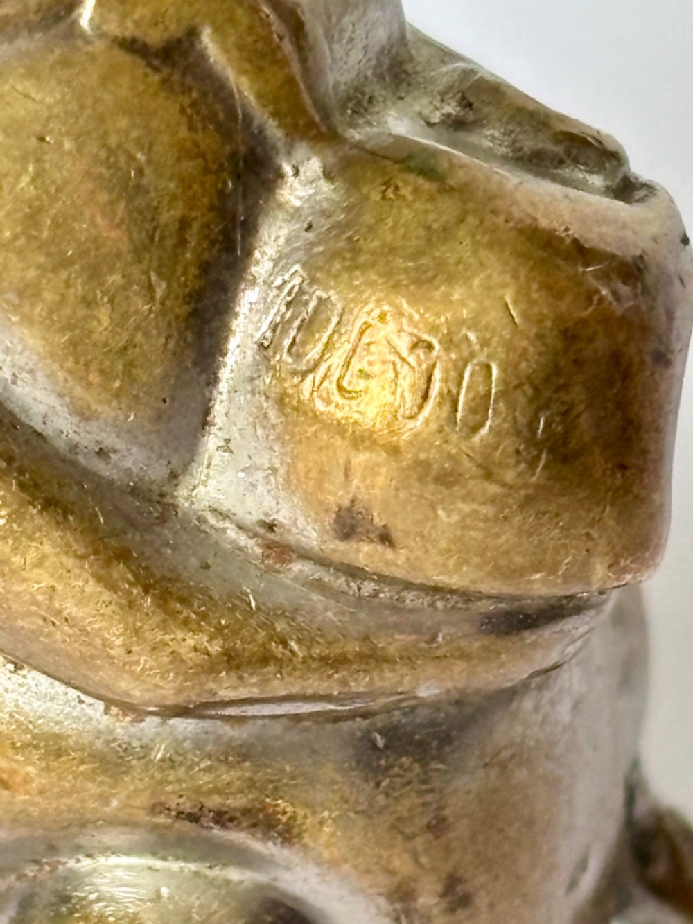 A small antique cast brass vesta case formed in the shape of a pig sitting upright. View III