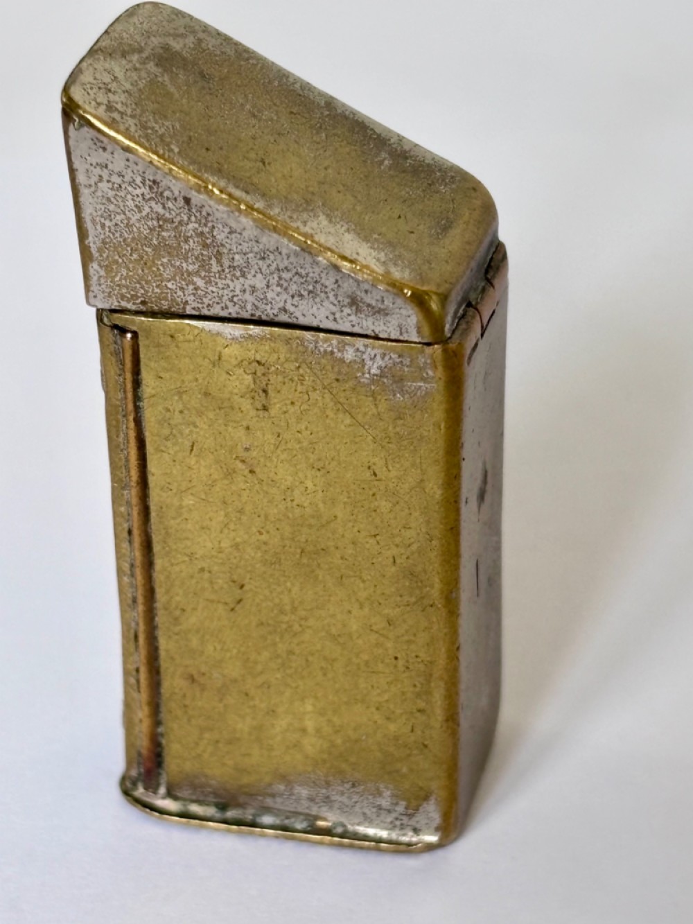 An antique Victorian brass novelty vesta case designed as an outhouse with an opening door revealing a gentleman seated inside. View V