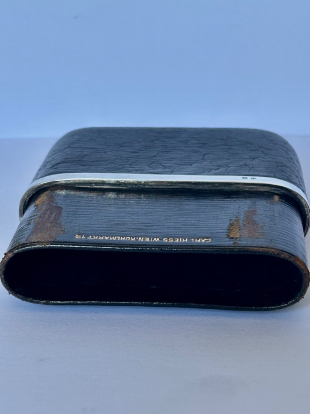 An antique black textured leather cigar case featuring a central hallmarked 900 silver collar. View XI