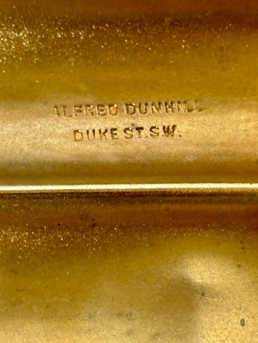 A four-tube sterling silver tobacco cartridge case with a hinged cover and smooth polished finish. View III