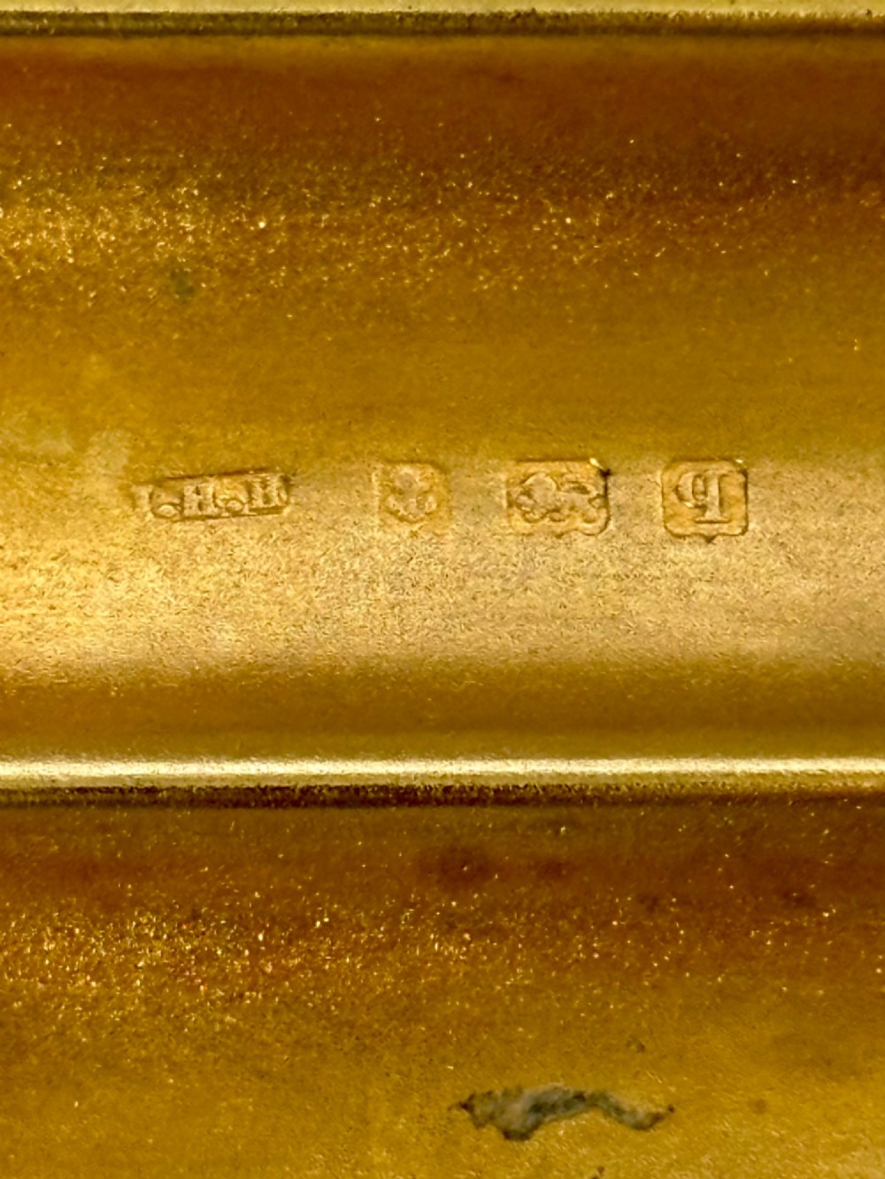 A four-tube sterling silver tobacco cartridge case with a hinged cover and smooth polished finish. View IV