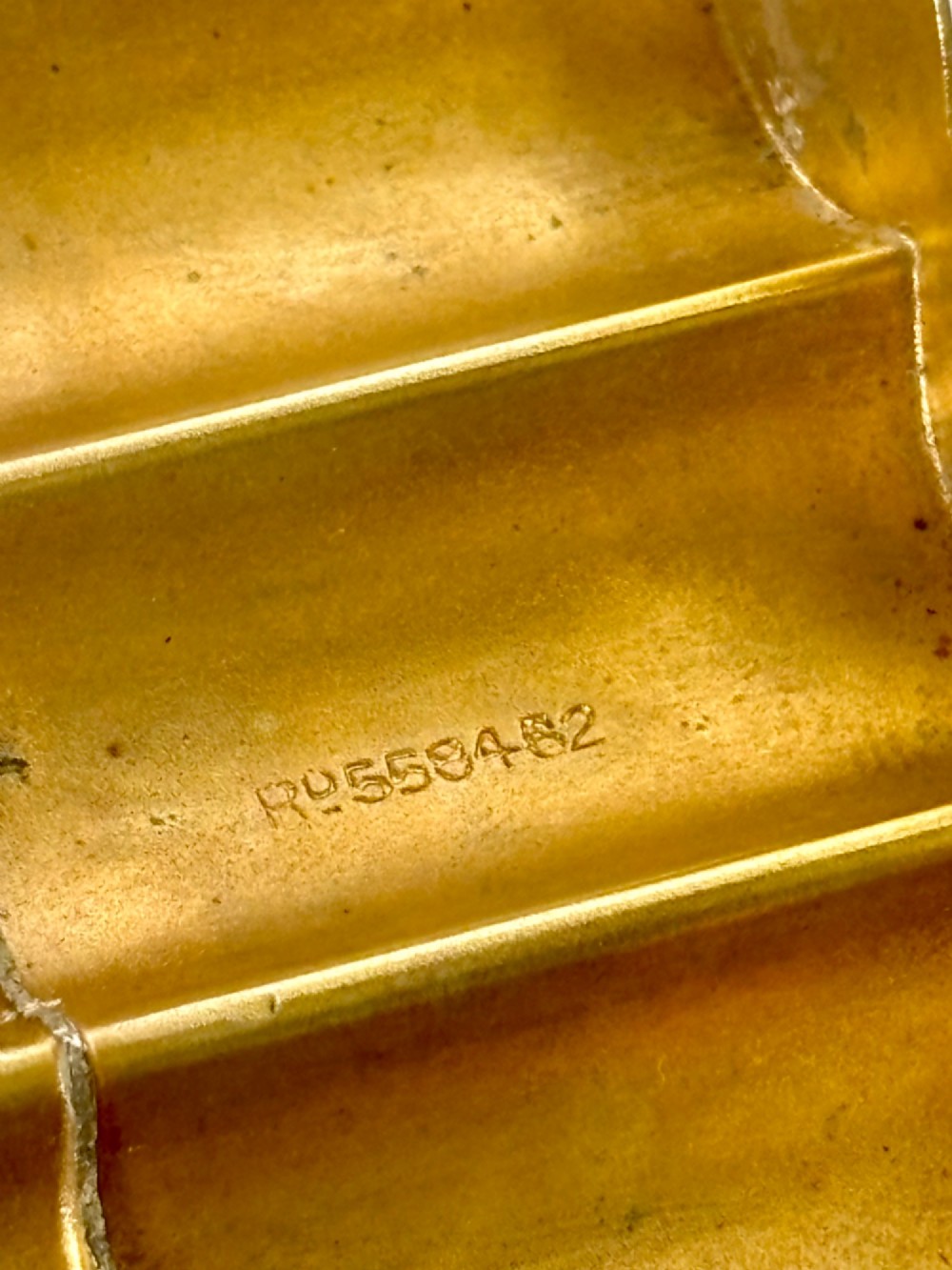 A four-tube sterling silver tobacco cartridge case with a hinged cover and smooth polished finish. View XIII