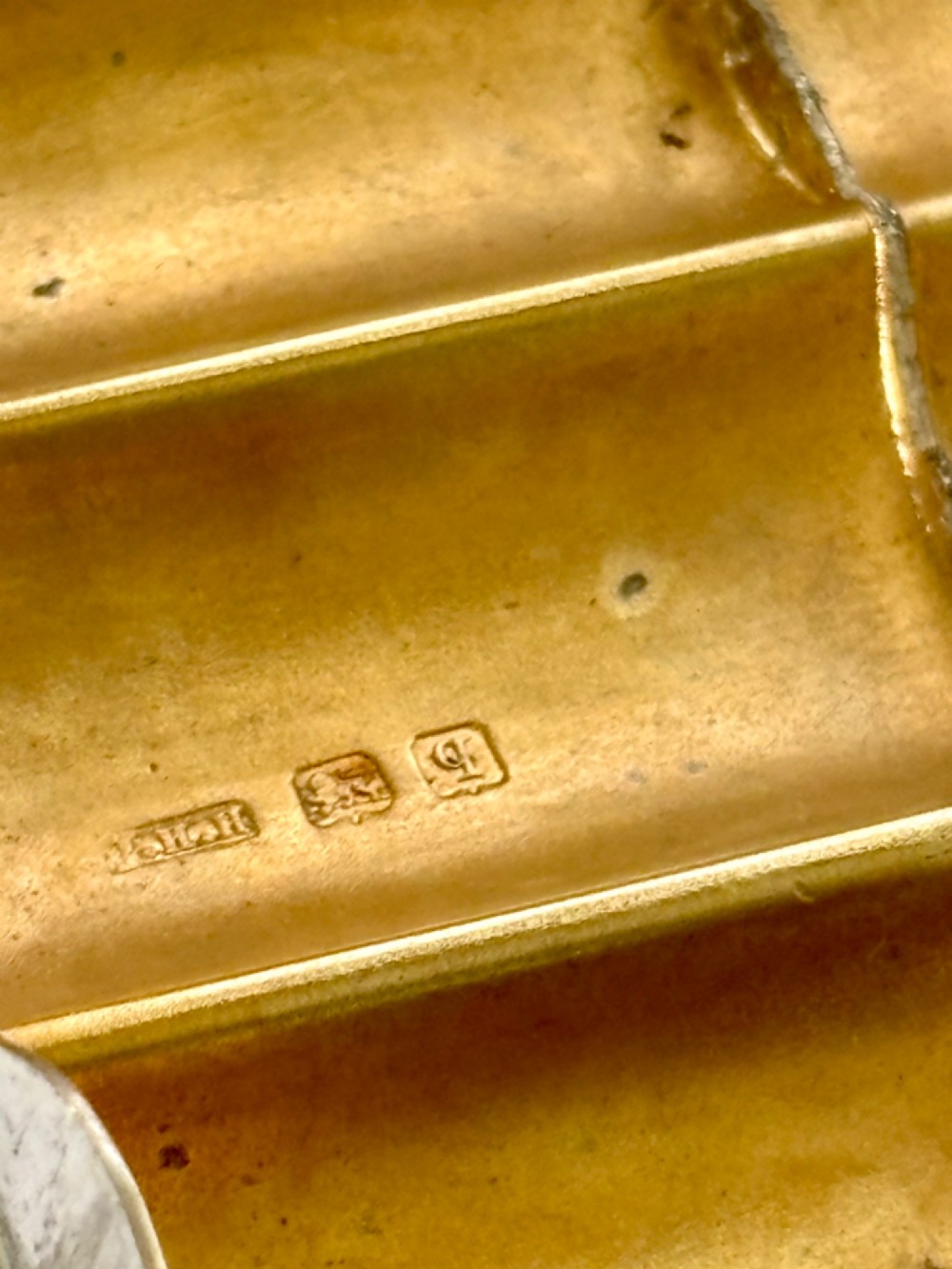 A four-tube sterling silver tobacco cartridge case with a hinged cover and smooth polished finish. View XIV