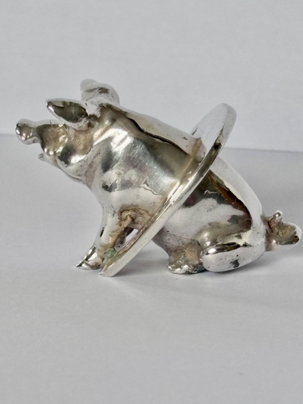 A Victorian sterling silver novelty figurine depicting a pig framed inside a horseshoe. View III