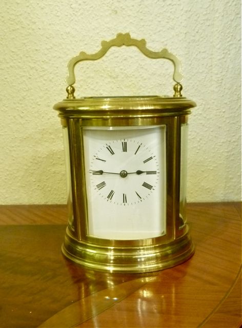 A Good Oval Striking Carriage Clock