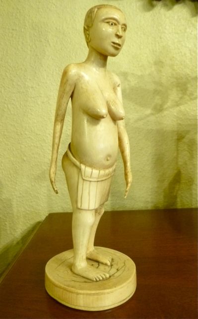 A Naive Carved Ivory Figure