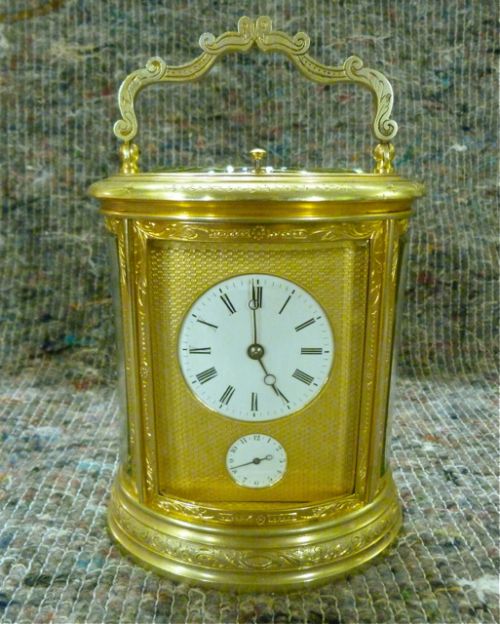 Very Fine Engraved Oval Carriage Clock