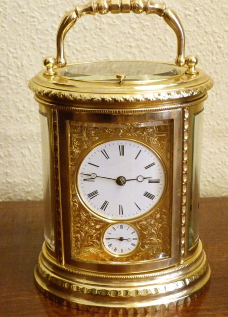 Fine French Engraved Repeating Oval Carriage Clock