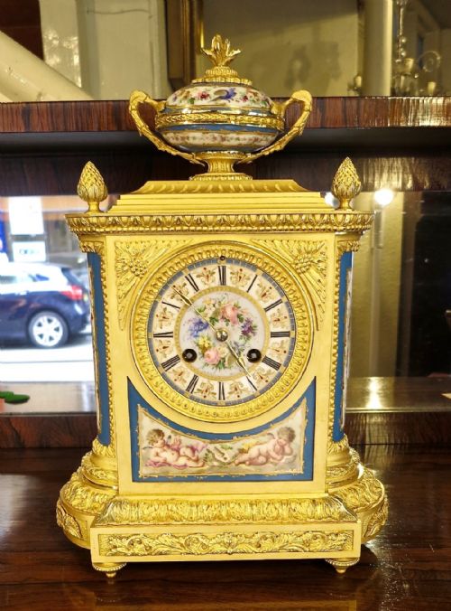 fig 1. FRENCH PORCELAIN-MOUNTED ORMOLU MANTLE CLOCK