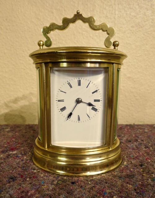Good French Oval Striking Carriage Clock