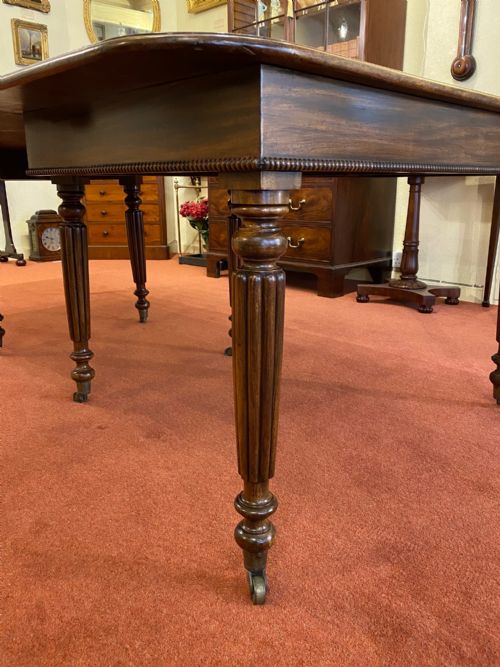 fig 1. A Good early 19th century mahogany extending DINING TABLE (seats 10)