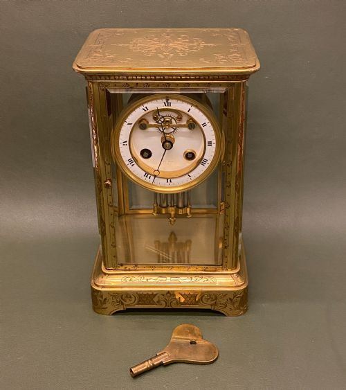 A Good French Engraved Brass 4-Glass Mantel Clock with Mercury Weighted Pendulum