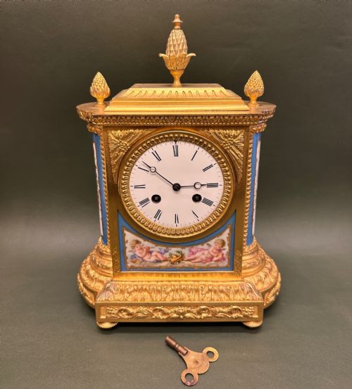A FINE QUALITY FRENCH ORMOLU PORCELAINMOUNTED MANTEL CLOCK BY JB DELETTREZ
