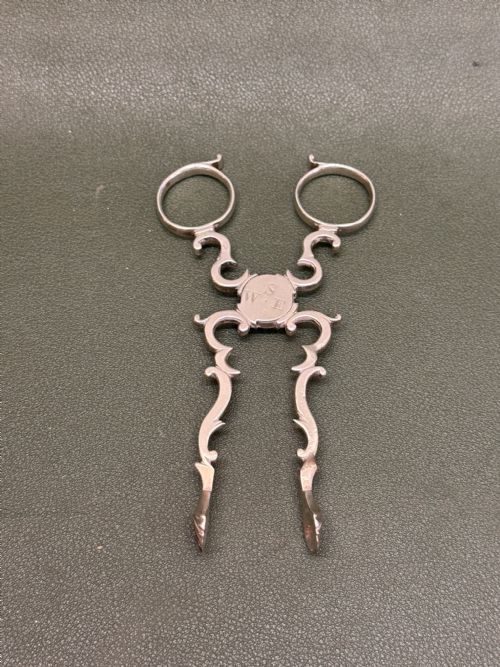 Fine Pair of 18th Century Hallmarked Silver Sugar Nips in Cast Rococo Form